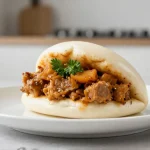 Heerlijke broodje bapao bereid in de Heteluchtfriteuse, perfect voor een snelle hap.