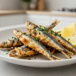 Heerlijk knapperige sardientjes bereid in de Airfryer voor een gezonde maaltijd.